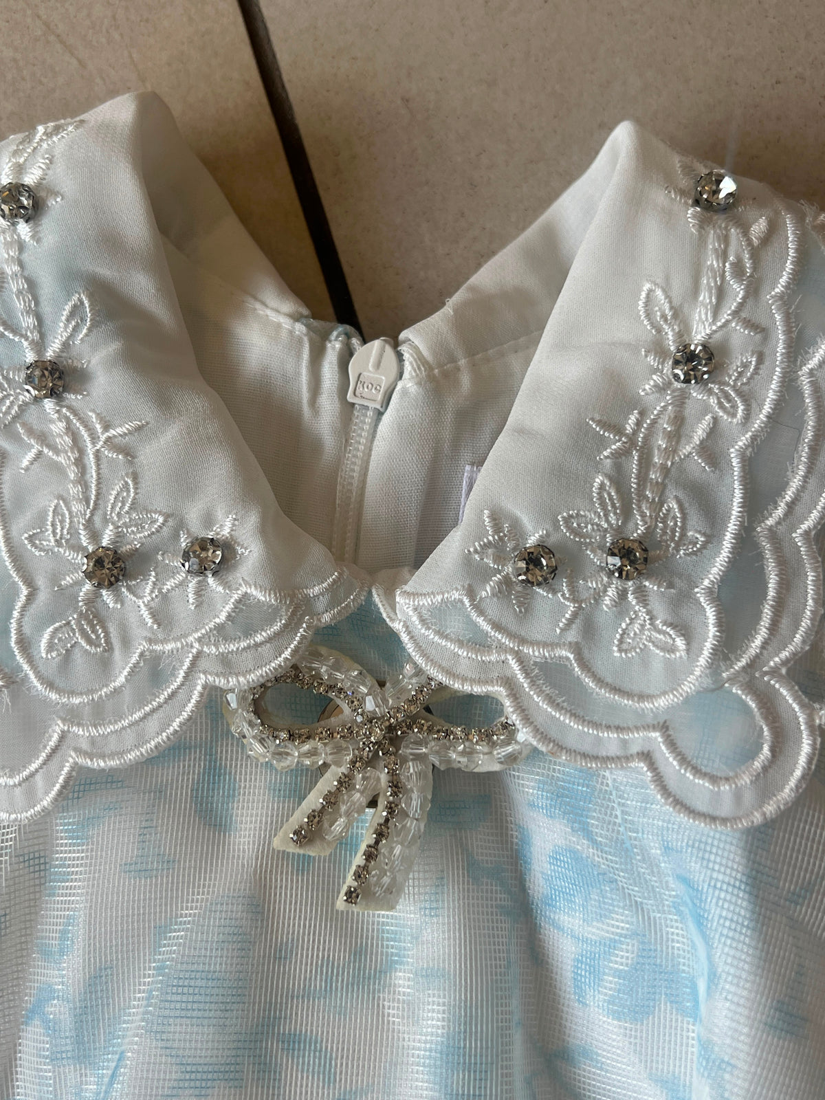 Blue Jacquard Frock with Lace Collar and Crystal Bow Brooch, Girls Ages 1-5, lifestyle view, aataa kidd