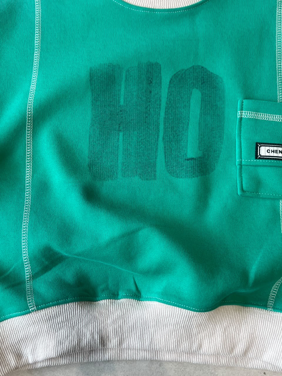 Kids Emerald Green Contrast Stitch Fleece Sweatshirt with Pocket | Ages 3–7, lifestyle view, aataa kidd