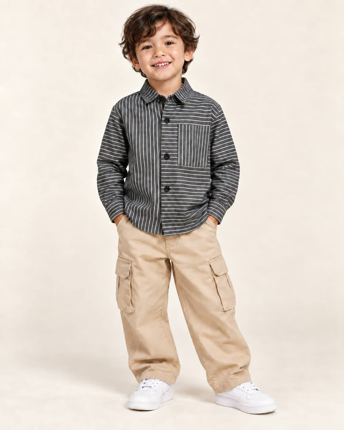 Boy wearing dark charcoal mixed pinstripe shirt with loose beige trousers