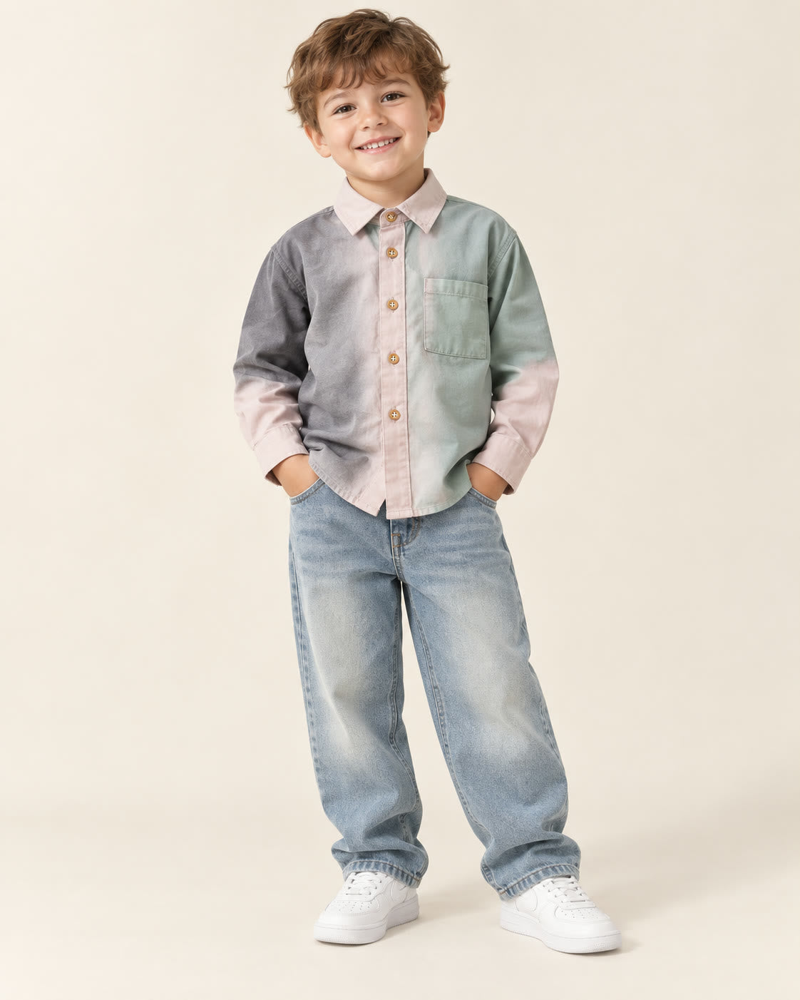 Boy wearing charcoal, blush and sage color-block shirt with loose jeans