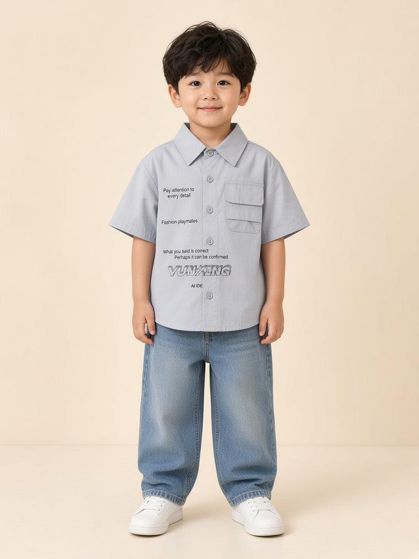 Boy wearing pale grey short-sleeve YUN-XING print shirt with stacked flap pockets and loose jeans