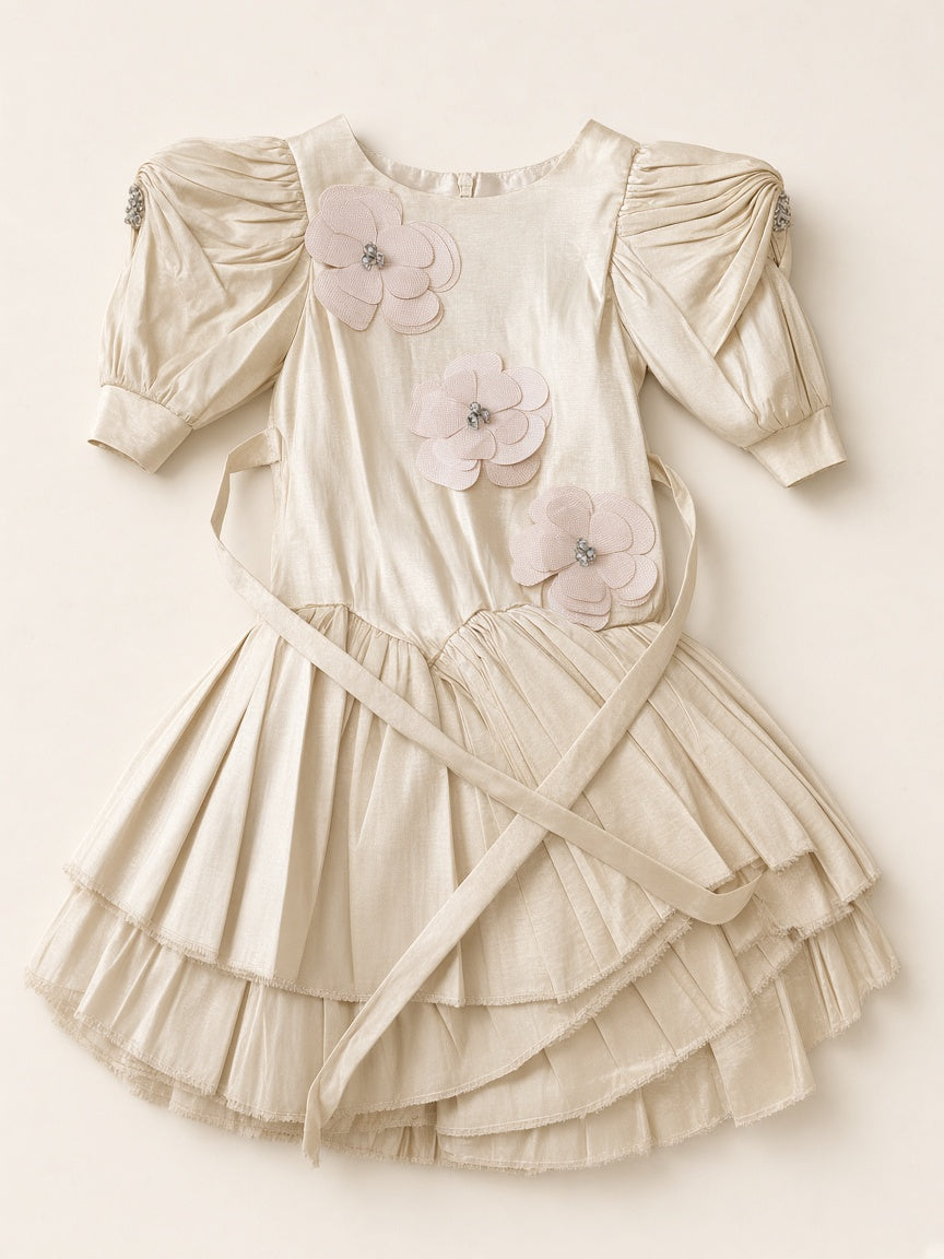 Ivory champagne floral appliqué party frock flat lay on cream studio
