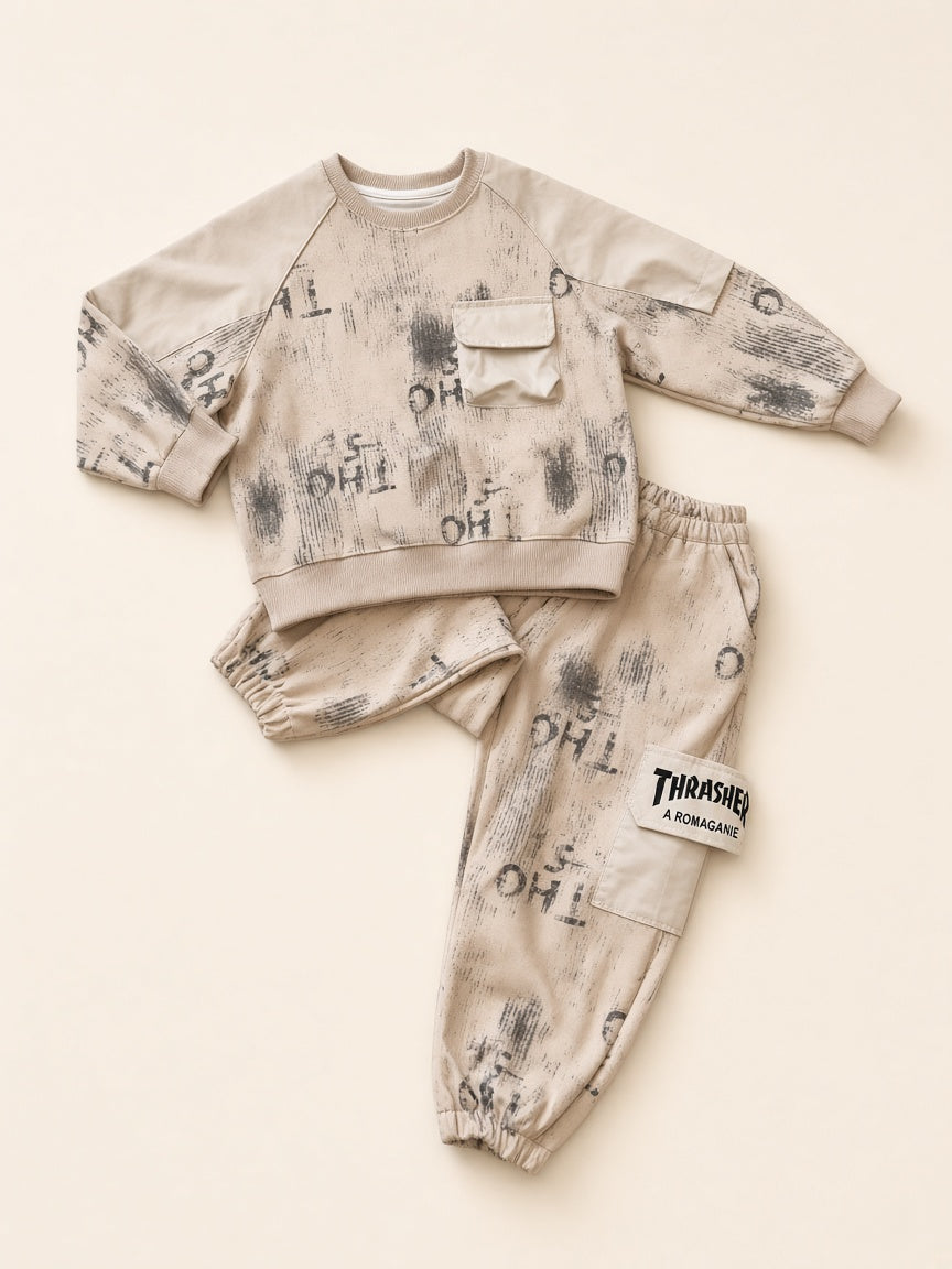 Beige distressed graffiti print kids two-piece set flat lay, sweatshirt and joggers
