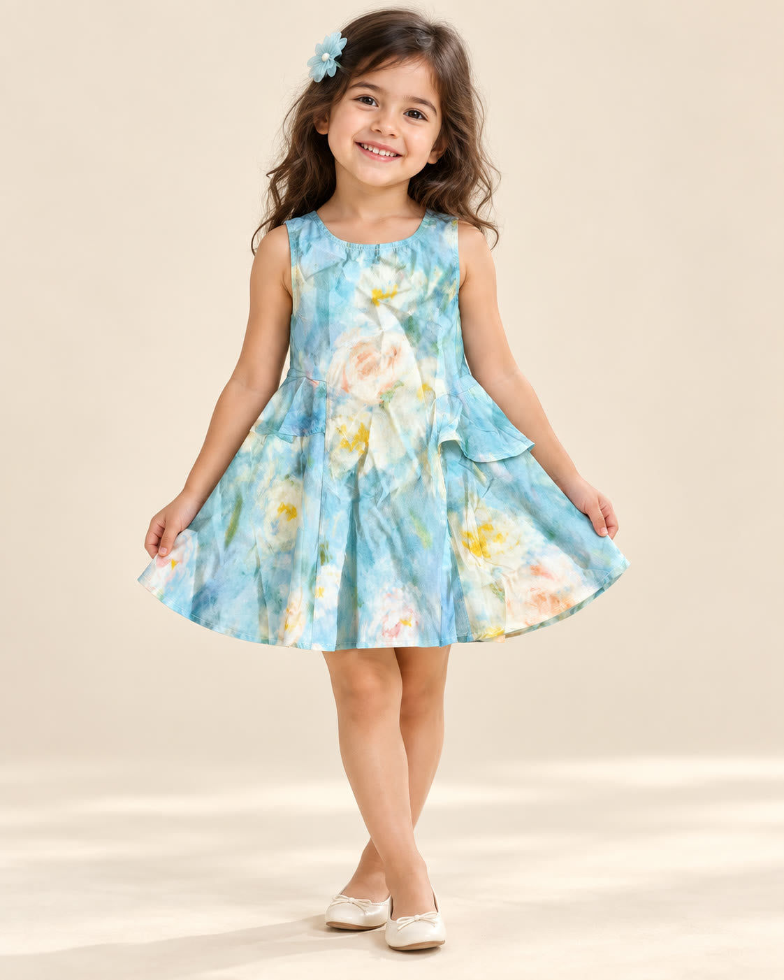 Girl wearing aqua watercolor sleeveless frock with asymmetric waist ruffles