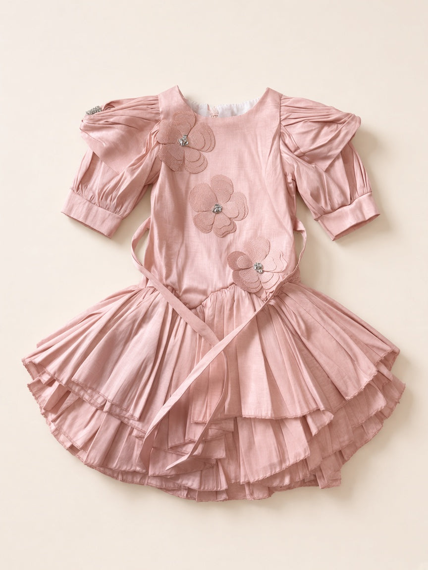 Dusty pink floral appliqué party frock flat lay on cream studio